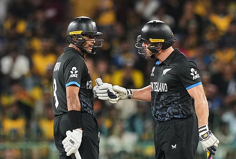 New Zealand's Rachin Ravindra, left, Glenn Phillips have a chat during the T20 World Cup cricket match between Sri Lanka and New Zealand in Colombo, Sri Lanka.