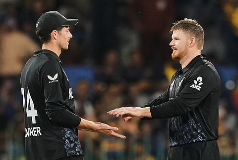 New Zealand's Glenn Phillips, right, celebrates with Mitchel Santner the wicket of Sri Lanka's Dunith Wellalage during the T20 World Cup cricket match between Sri Lanka and New Zealand in Colombo, Sri Lanka.