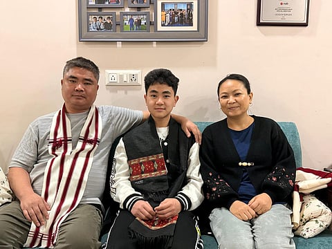  Gugun Kipgen with his parents at his house in Delhi 