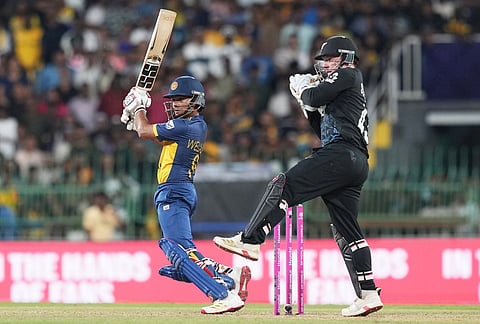 Sri Lanka's Dunith Wellalage plays a shot during the T20 World Cup cricket match between Sri Lanka and New Zealand in Colombo, Sri Lanka.
