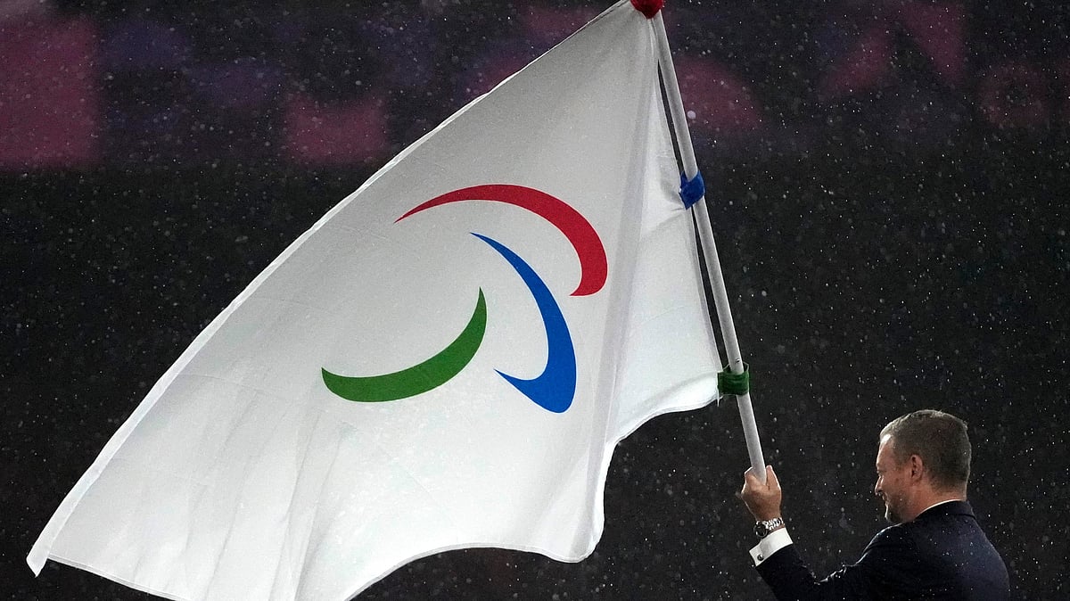 (AP Photo/Michel Euler, File) : FILE - President of the International Paralympic Committee Andrew Parsons passes the Paralympic flag to Mayor of Los Angeles Karen Bass, not pictured, after receiving it from Mayor of Paris Anne Hidalgo, not pictured, during the closing ceremony of the 2024 Paralympics, Sept. 8, 2024, in Paris.