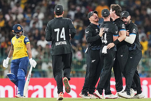 New Zealand's Matt Henry, centre, celebrates with teammates the wicket of Sri Lanka's Pathum Nissanka, left, during the T20 World Cup cricket match between Sri Lanka and New Zealand in Colombo, Sri Lanka.