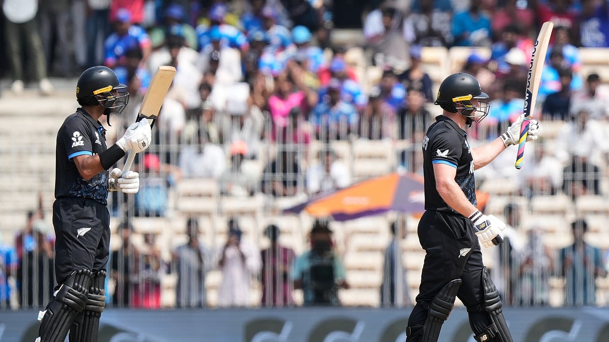 (AP Photo/Mahesh Kumar A.) : New Zealand's Glenn Phillips, right, celebrates his fifty runs during the T20 World Cup cricket match between Canada and New Zealand in Chennai, India, Tuesday, Feb. 17, 2026.