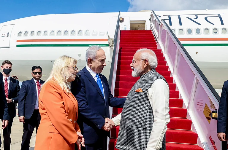Prime Minister Narendra Modi being welcomed by his Israeli counterpart Benjamin Netanyahu and his wife Sara Netanyahu upon arrival in Tel Aviv, Israel. - PTI
