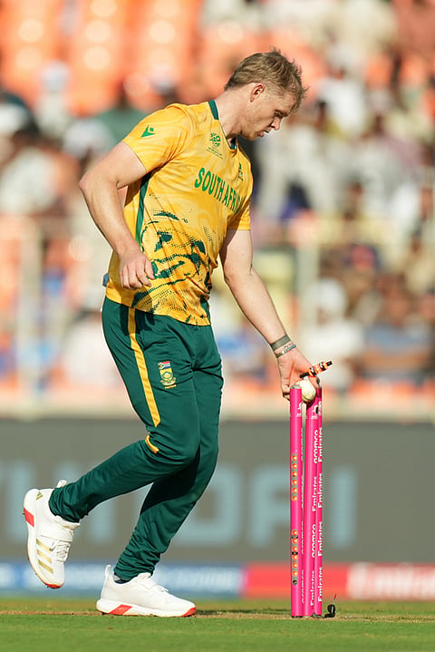 South Africa's Corbin Bosch takes the bails off to run West Indies' Jason Holder out during the T20 World Cup cricket match between South Africa and West Indies in Ahmedabad.