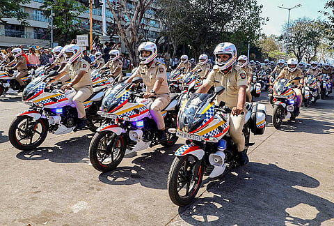 Police personnel during inauguration of the Brihanmumbai Police Force's advanced vehicles by Maharashtra Chief Minister Devendra Fadnavis, unseen. 