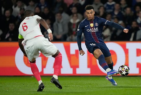 PSG's Desire Doue passes the ball during a Champions League second leg playoff soccer match between Paris Saint-Germain and Monaco in Paris.
