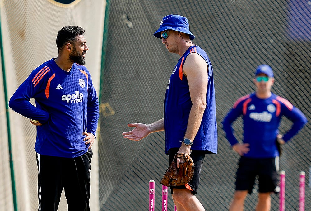 | Photo: PTI/R Senthilkumar : India's Varun Chakaravarthy, left, during a training session ahead of the ICC Men's T20 World Cup 2026 cricket match between India and Zimbabwe, at MA Chidambaram Stadium, in Chennai.