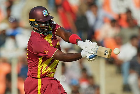 West Indies' Jason Holder plays a shot during the T20 World Cup cricket match between South Africa and West Indies in Ahmedabad.