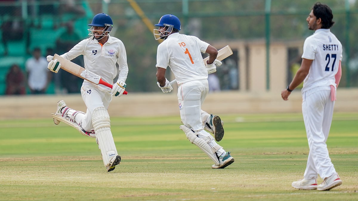 PTI : Jammu and Kashmir's captain Paras Dogra and teammate Kanhaiya Wadhawan run between the wickets during the second day of the Ranji Trophy 2025-26 final against Jammu and Kashmir in Hubballi.