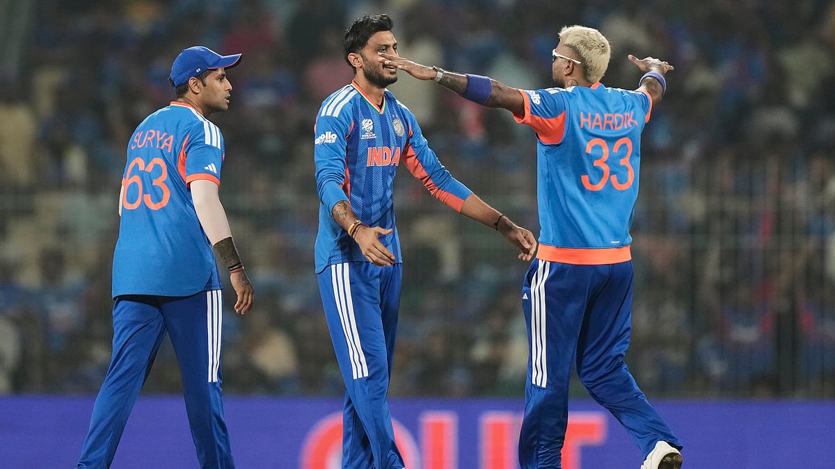 India's Axar Patel, center, celebrates with teammates the wicket of Zimbabwe's Tadiwanashe Marumani during the T20 World Cup cricket match between India and Zimbabwe in Chennai, India, Thursday, Feb. 26, 2026 - (AP Photo/Mahesh Kumar A.)