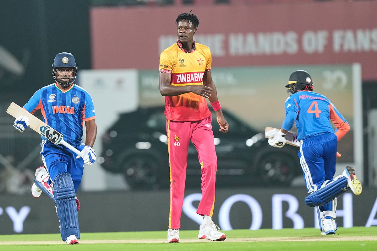 | Photo: AP/Mahesh Kumar A. : India's Sanju Samson, left, and Abhishek Sharma, right, run between the wickets as Zimbabwe's Blessing Muzarabani looks on during the T20 World Cup cricket match between India and Zimbabwe in Chennai, India, Thursday, Feb. 26, 2026. 