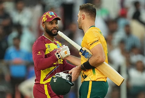 South Africa's captain Aiden Markram, right, is congratulated by West Indies' captain Shai Hope after South Africa won their T20 World Cup cricket match against West Indies in Ahmedabad.
