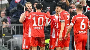 | Photo: dpa/Harry Langer via AP : Bayern Munich's Harry Kane, left, celebrates scoring with teammates during the Bundesliga soccer match between Bayern Munich and Eintracht Frankfurt in Munich, Germany, Saturday Feb. 21, 2026.