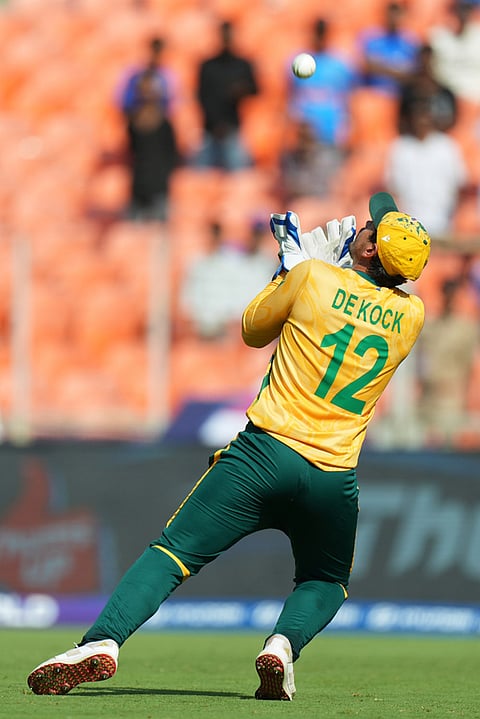 South Africa's Quinton de Kock takes the catch to dismiss West Indies' Sherfane Rutherford during the T20 World Cup cricket match between South Africa and West Indies in Ahmedabad.