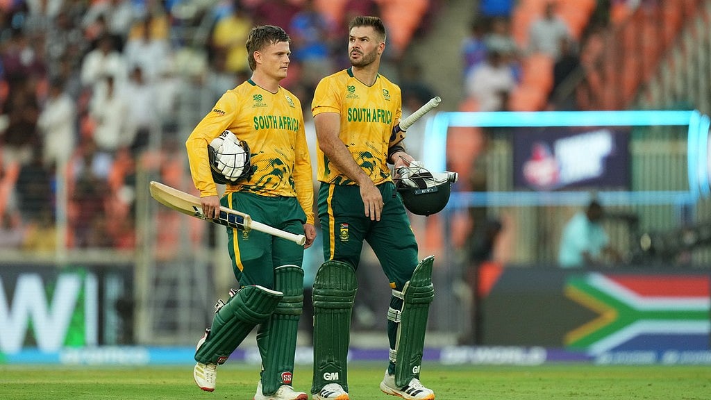 AP Photo/Ajit Solanki : South Africa's captain Aiden Markram, right, and batting partner Ryan Rickelton leave the ground after winning their T20 World Cup cricket match against West Indies in Ahmedabad, India, Thursday, Feb. 26, 2026.
