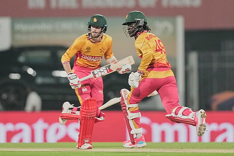 Zimbabwe's Brian Bennett, left, and Tadiwanashe Marumani run between the wickets during the T20 World Cup cricket match between India and Zimbabwe in Chennai, India.