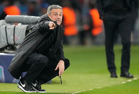 PSG's head coach Luis Enrique gives instructions during a Champions League second leg playoff soccer match between Paris Saint-Germain and Monaco in Paris.