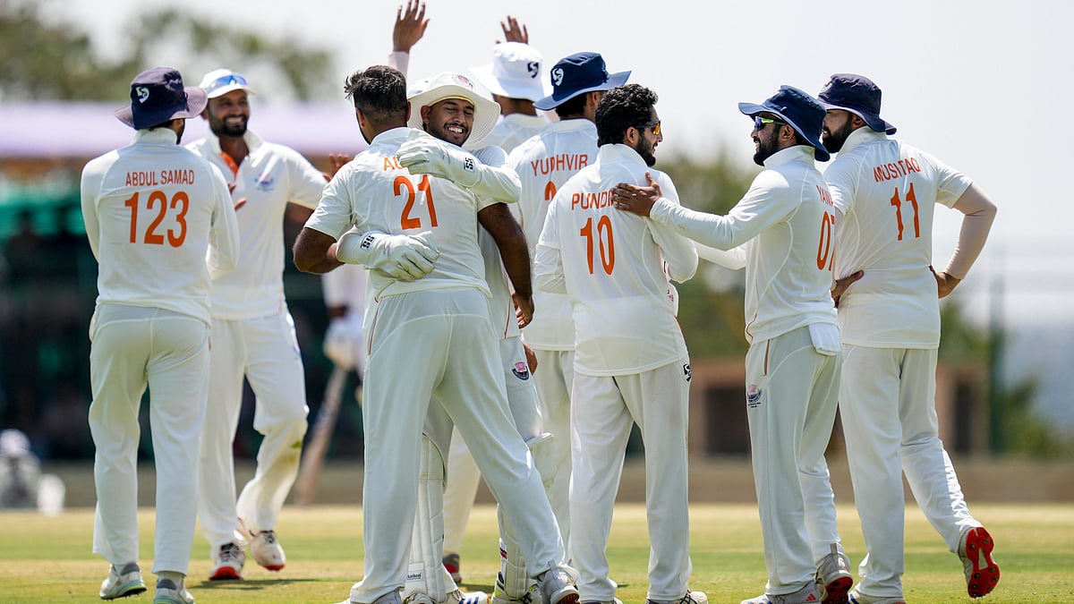 | Photo: PTI/Shailendra Bhojak : Jammu and Kashmir's Auqib Nabi celebrates with teammates after taking the wicket of Karnataka's Smaran Ravichandran during the third day of the Ranji Trophy 2025-26 final cricket match between Karnataka and Jammu and Kashmir at the KSCA Cricket Stadium, in Hubballi, Karnataka, Thursday, Feb. 26, 2026. 