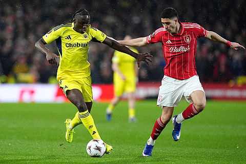 Fenerbahce's Sidiki Cherif, left, and Nottingham Forest's Jair Cunha during the Europa League knockout phase play-off second leg match between Nottingham Forest and Fenerbahce in Nottingham, England.