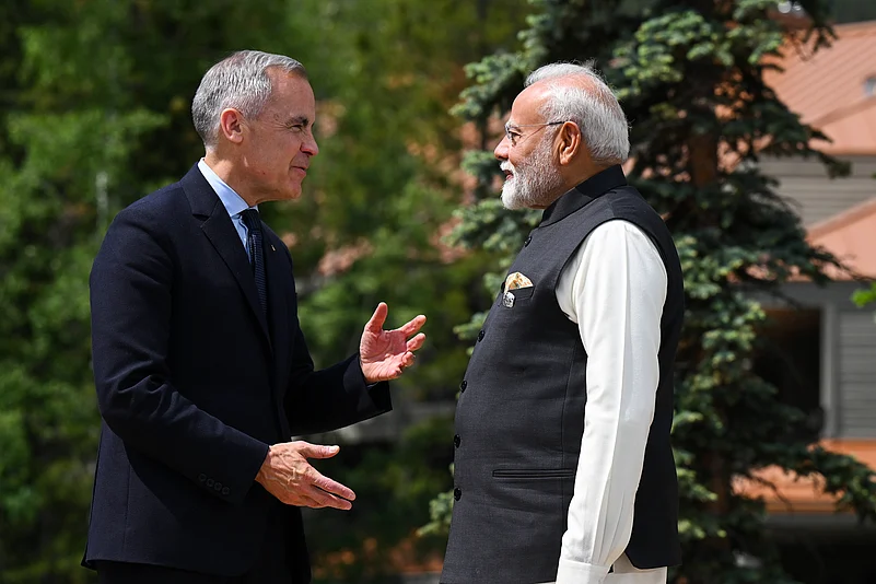 Prime Minister of Canada Mark Carney greets Prime Minister of India Narendra Modi
