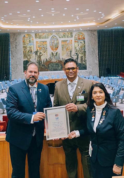 Arun Kar receiving an award