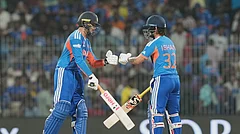 India's Abhishek Sharma, left, fist bumps his batting partner Ishan Kishan during the T20 World Cup cricket match between India and Zimbabwe in Chennai, India, Thursday, Feb. 26, 2026. - (AP Photo/Mahesh Kumar A.)