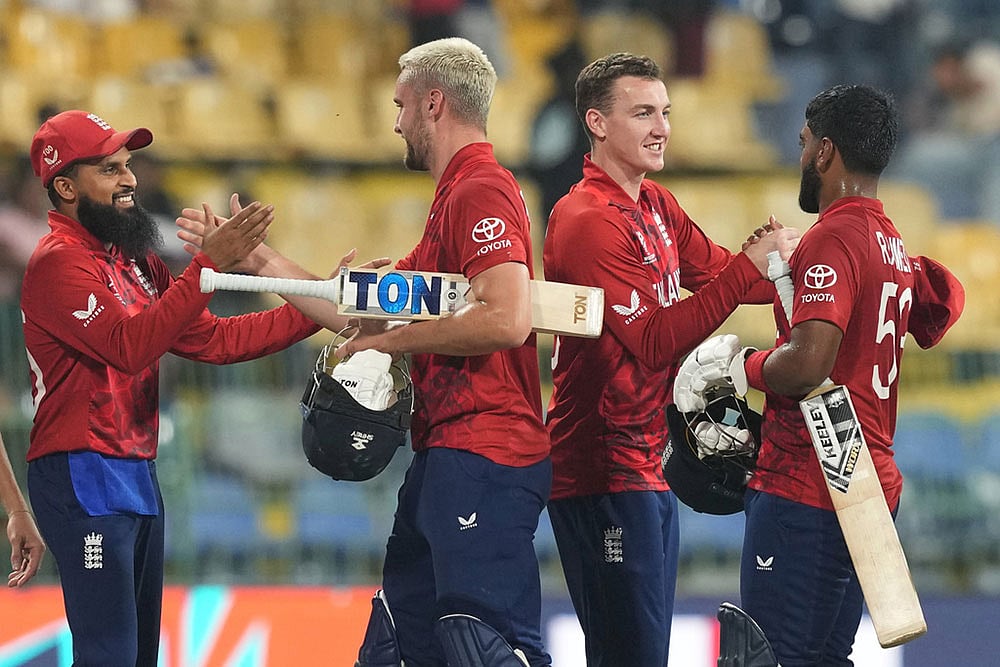 | Photo: AP/Eranga Jayawardena : England's captain Harry Brook, second from right celebrates with teammates after their win against New Zealand during the T20 World Cup cricket match in Colombo, Sri Lanka.