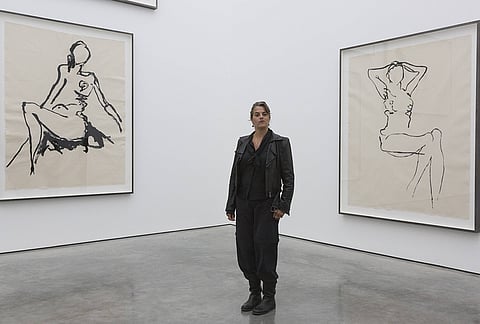 Artist Tracey Emin poses in front of large-scale embroideries. Tracey Emin's exhibition "The Last Great Adenture is You" was on view at the White Cube Gallery, Bermondsey, London .