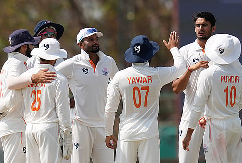 Jammu and Kashmir's team celebrates a wicket of Karnataka's Vidyadhar Patil on day four of the Ranji Trophy 2025-26 final cricket match between Karnataka and Jammu and Kashmir, at KSCA Cricket Stadium, in Hubballi, Dharwad district.