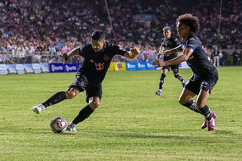 Inter Miami's Luis Suarez fights for the ball with Andy Velasco of Ecuador's Independiente del Valle during an international friendly soccer match in Bayamon, Puerto Rico.