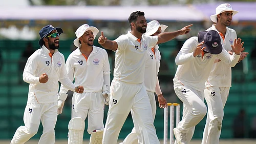 PTI : Jammu and Kashmirs Auqib Nabi with teammates, celebrates the wicket of Karnatakas Mayank Agarwal on day four of their Ranji Trophy 2025-26 final at KSCA Cricket Stadium in Hubballi.