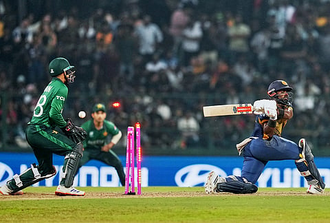 Sri Lanka's Charith Asalanka is bowled out by Pakistan's Abrar Ahmed during the T20 World Cup cricket match between Pakistan and Sri Lanka in Pallekele, Sri Lanka.