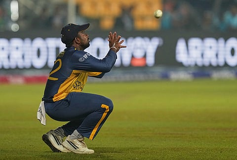 Sri Lanka's Charith Asalanka takes the catch to dismiss Pakistan's Khawaja Nafay during the T20 World Cup cricket match between Pakistan and Sri Lanka in Pallekele, Sri Lanka.