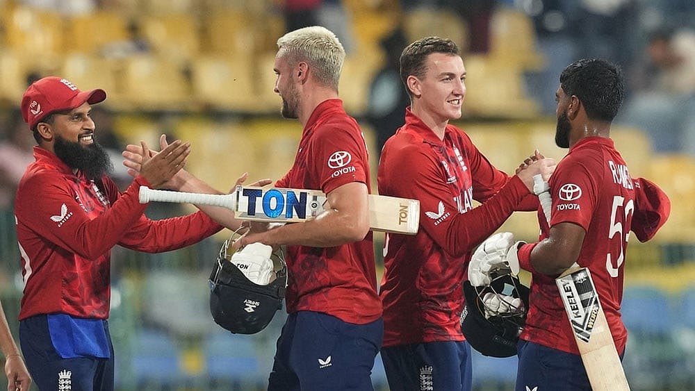| Photo: AP/Eranga Jayawardena : England's captain Harry Brook, second from right celebrates with teammates after their win against New Zealand during the T20 World Cup cricket match in Colombo, Sri Lanka.