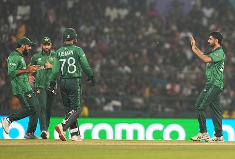Pakistan's Abrar Ahmed, right, celebrates with teammates the wicket of Sri Lanka's Kamil Mishara during the T20 World Cup cricket match between Pakistan and Sri Lanka in Pallekele, Sri Lanka.