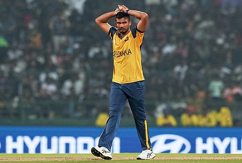 Sri Lanka's captain Dasun Shanaka reacts after getting hit for a boundary during the T20 World Cup cricket match between Pakistan and Sri Lanka in Pallekele, Sri Lanka.