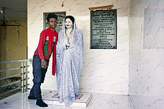 | Photo: Animikh Chakrabarty : The Devi Incarnation: Anmol, a resident of Sheikhpur Gurha village in Jalaun district, Uttar Pradesh, next to Phoolan Devi’s statue at the entrance of her home in the village