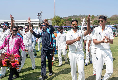 Jammu and Kashmir's Auqib Nabi with teammates celebrates the team's victory in the Ranji Trophy 2025-26 final cricket match against Karnataka, at KSCA Stadium, in Hubballi, Karnataka.