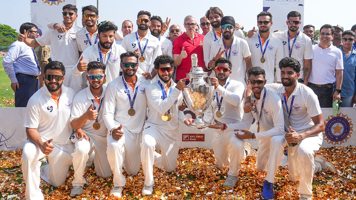 PTI : Jammu and Kashmir players pose with the trophy after the team's victory in the Ranji Trophy 2025-26 final against Karnataka, at KSCA Stadium in Hubballi.