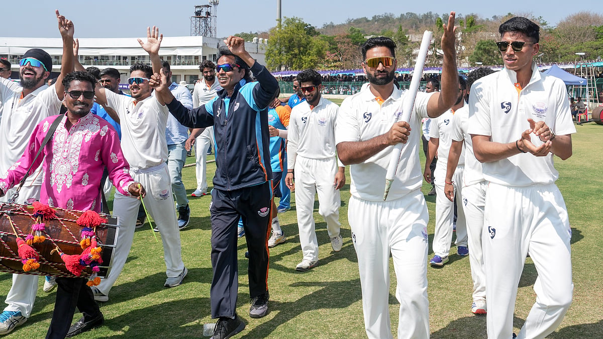 PTI/Shailendra Bhojak : Jammu and Kashmir's Auqib Nabi with teammates celebrates the team's victory in the Ranji Trophy 2025-26 final against Karnataka, at KSCA Stadium in Hubballi.