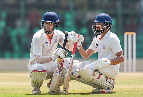 Jammu and Kashmir's Sahil Lotra and Qamran Iqbal during the break on day five of the Ranji Trophy 2025-26 final cricket match between Karnataka and Jammu and Kashmir, at KSCA Cricket Stadium, in Hubballi, Dharwad district.