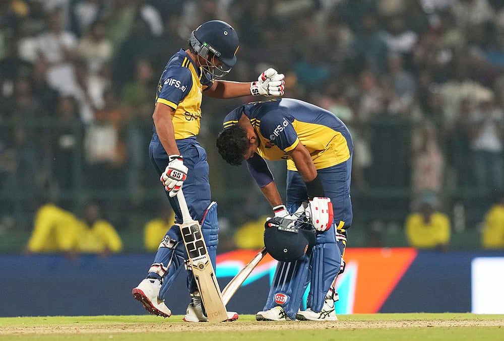 | Photo: AP/Eranga Jayawardena : Sri Lanka's captain Dasun Shanaka, right, is consoled by teammate Dunith Wellalage after losing the T20 World Cup cricket match against Pakistan in Pallekele, Sri Lanka.