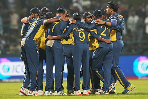 Sri Lanka's players form a huddle before the start of the T20 World Cup cricket match between Pakistan and Sri Lanka in Pallekele, Sri Lanka.