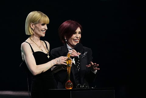 Kelly Osbourne, left and Sharon Osbourne speak on stage during the Brit Awards 2026 in Manchester, England.