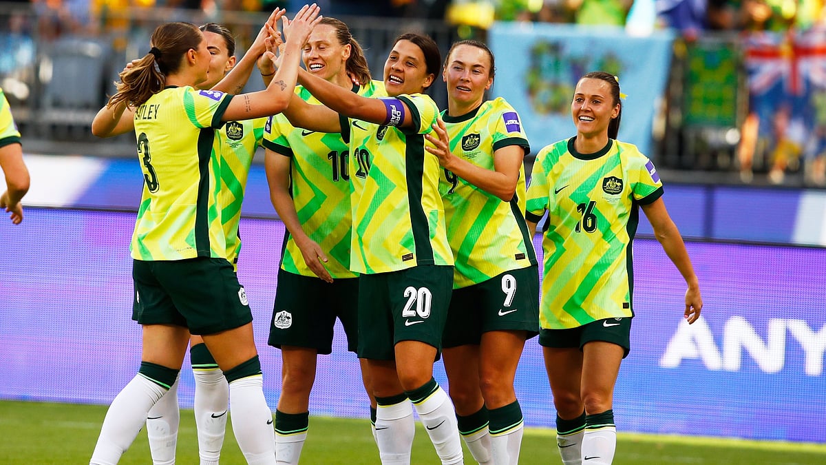 Australia's Sam Kerr, centre, is congratulated by teammates after scoring her team's first goal during the Women's Asia Cup soccer match between Australia and the Philippines in Perth, Australia, Sunday, March 1, 2026.  - | Photo: AP/Gary Day