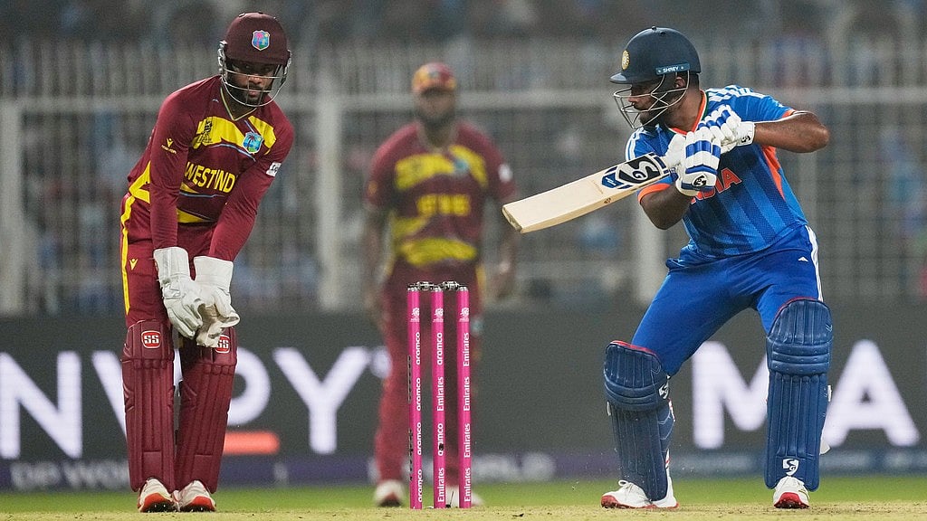 Photo: AP : India's Sanju Samson plays a shot during the T20 World Cup cricket match between India and West Indies in Kolkata.