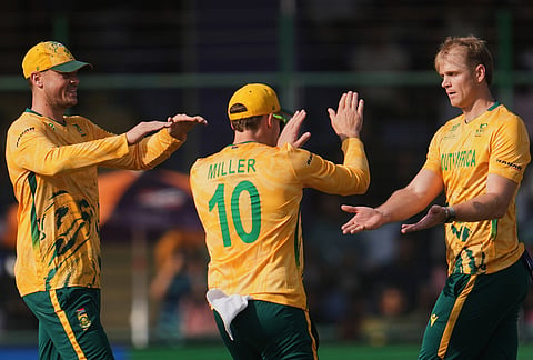 South Africa's Corbin Bosch, right, celebrates with teammates the wicket of Zimbabwe's Tony Munyonga during the T20 World Cup cricket match between South Africa and Zimbabwe in New Delhi.