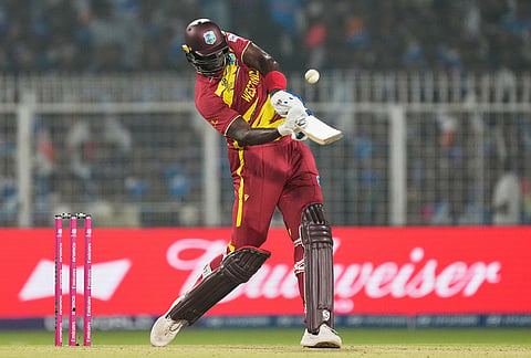 West Indies' Jason Holder plays a shot during the T20 World Cup cricket match between India and West Indies in Kolkata.