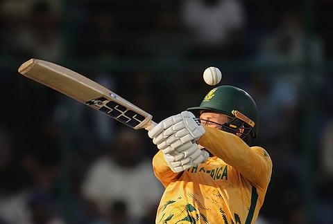 A delivery from Zimbabwe's Bradley Evans hits the helmet of South Africa's Ryan Rickelton during the T20 World Cup cricket match between South Africa and Zimbabwe in New Delhi.